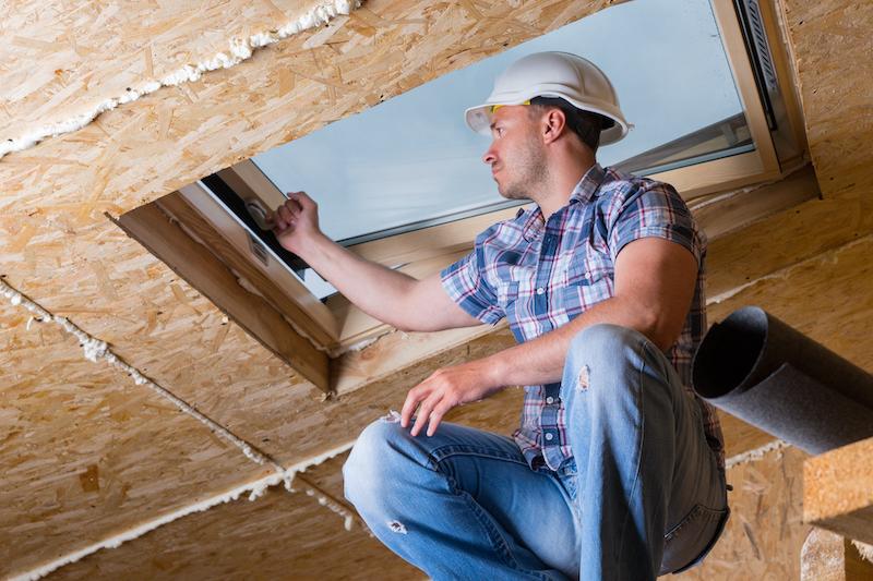 A main installs a skylight to add value to his home.